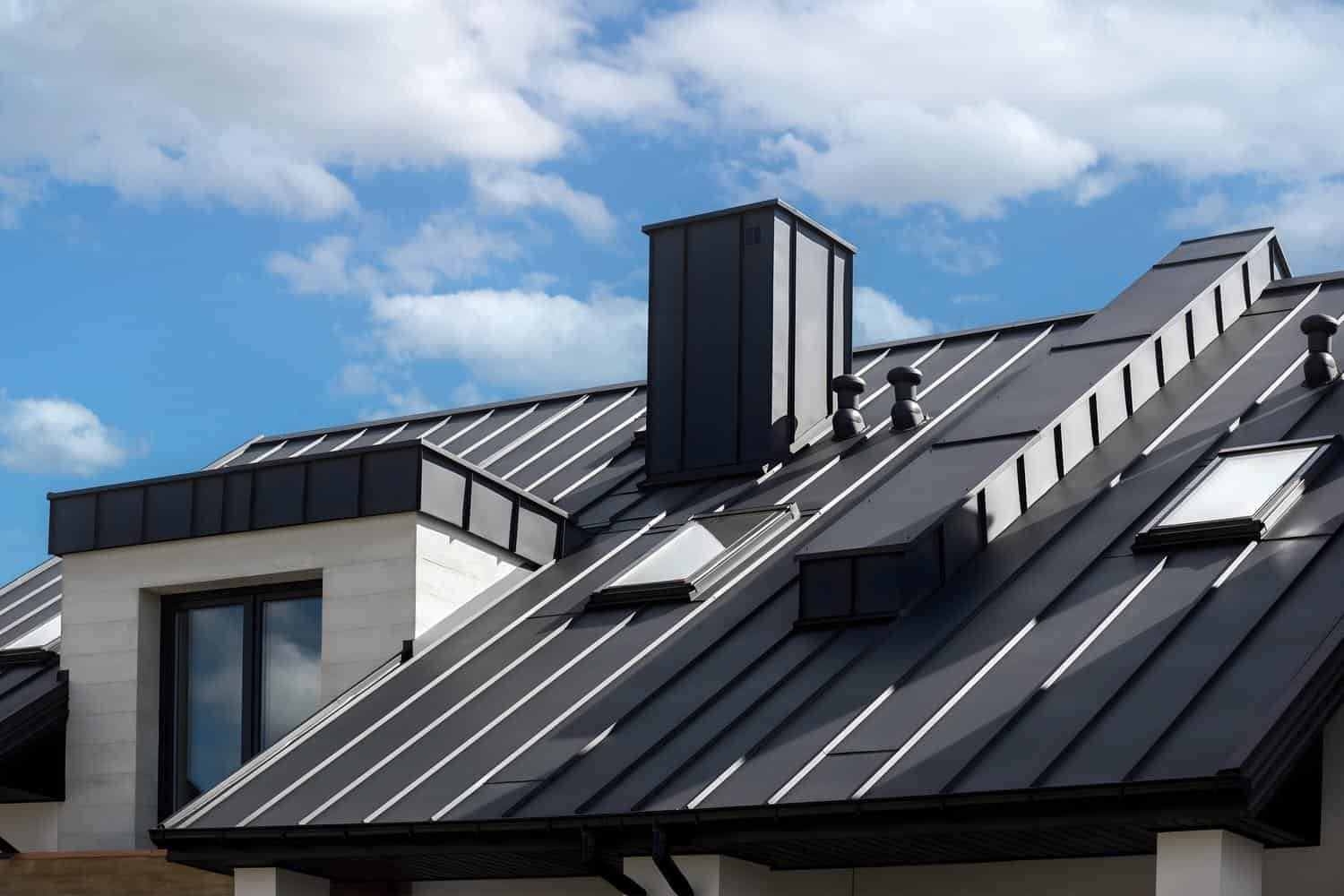Modern home with a black standing seam metal roof