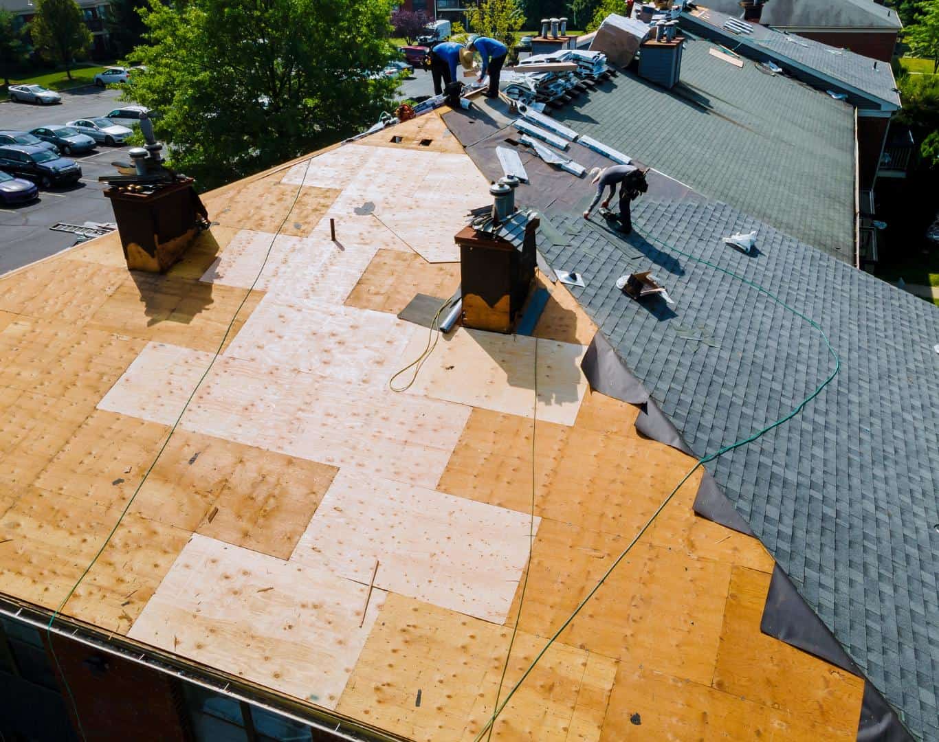 Roof replacement underway with new decking and shingles