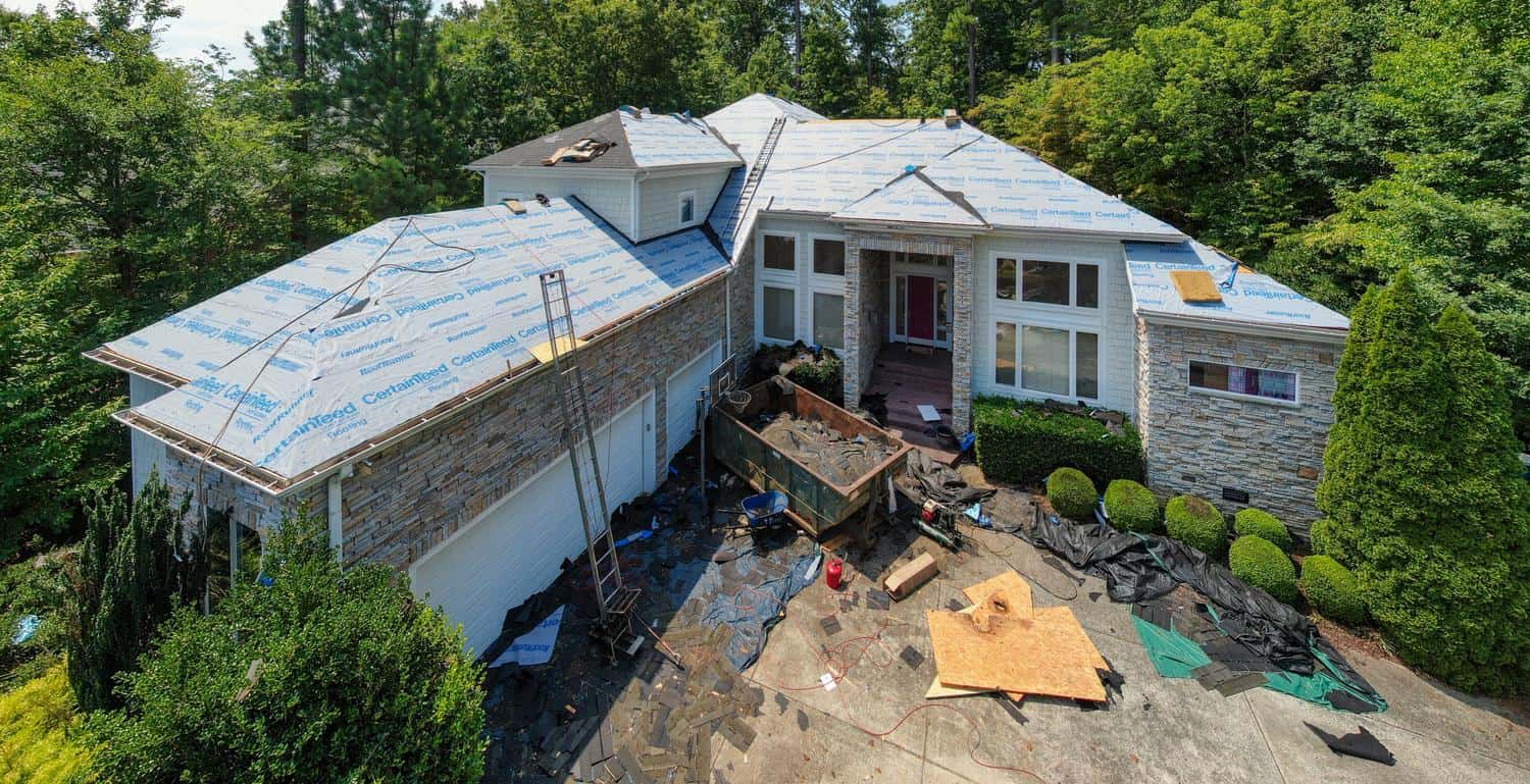 House undergoing a roof replacement, seen from above